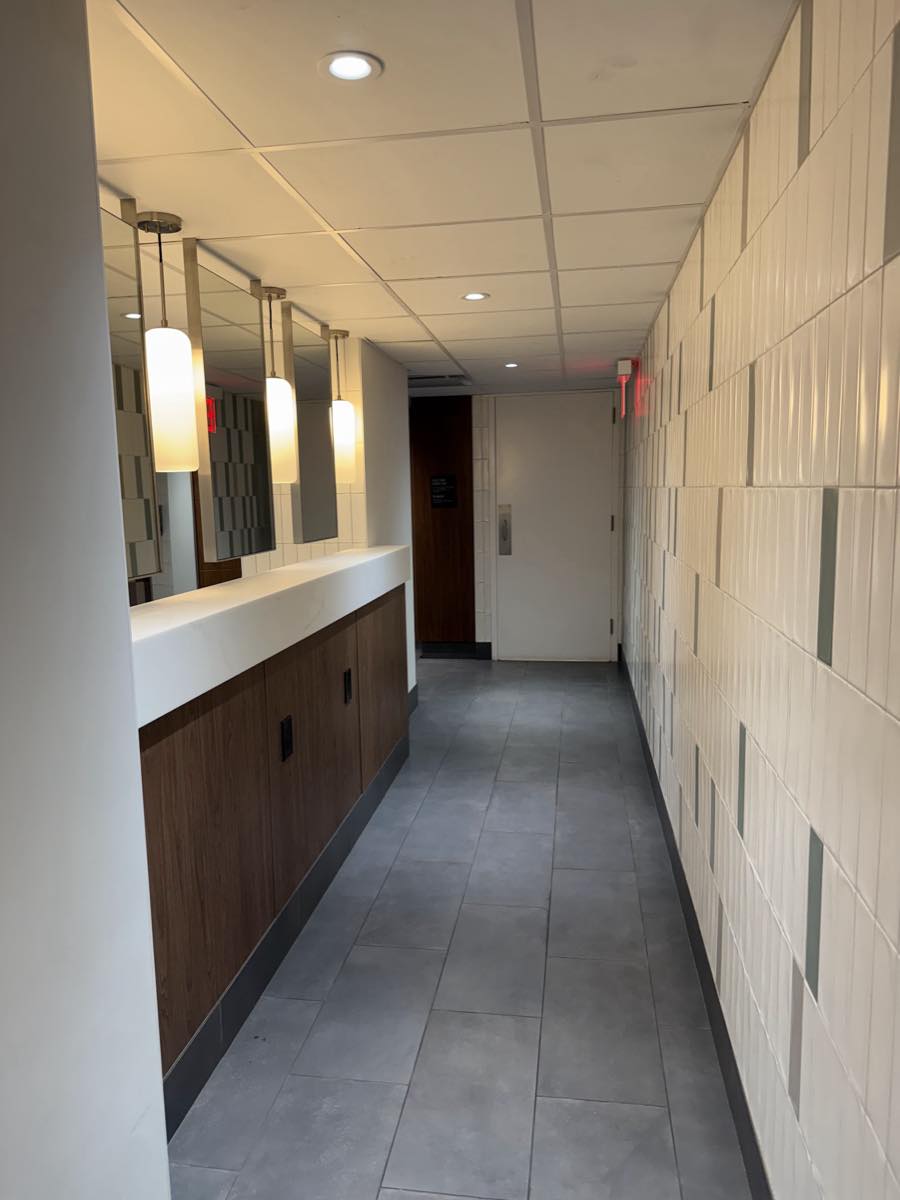 The exit door at the far end of the women's locker room